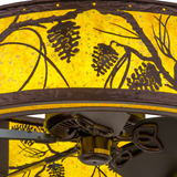 Closeup of pinecone detailing and illuminated amber mica diffuser.