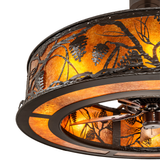 Close-up of metal pinecone design against amber mica diffuser.