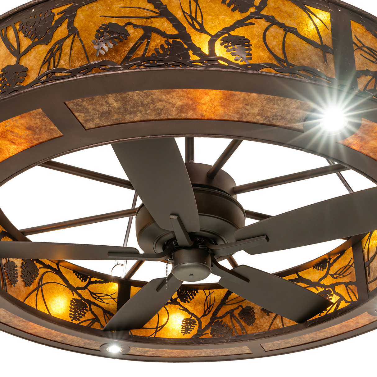 Close-up of fan blades and decorative pinecone detailing.