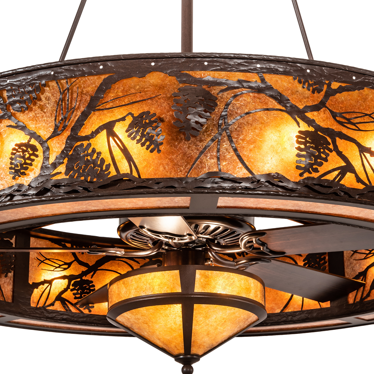 Closeup of pinecone motif and amber mica illumination.