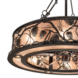 Close-up of handcrafted pinecone detailing on mica shade.