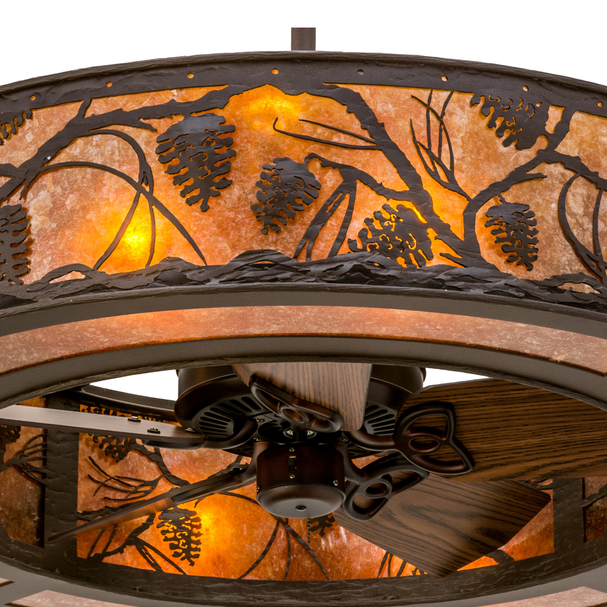 Close-up lit view showing intricate pine branch details and inner fan blades.