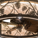 Closeup lit view capturing bronze finish and pinecone silhouette detail.