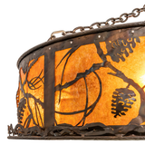 Closeup of handcrafted metal pinecone pattern and mica shade texture.