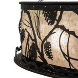Edge detail showing textured wrought iron frame and pine motif outline.