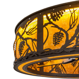 Close-up of Whispering Pines Chandel-Air frame with pinecone detailing.