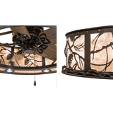 Closeup of Whispering Pines Chandel-Air fan blades and mica shade with pinecone metal accents.