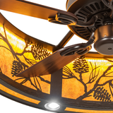 Close-up of fan blades against glowing pinecone metal shade.