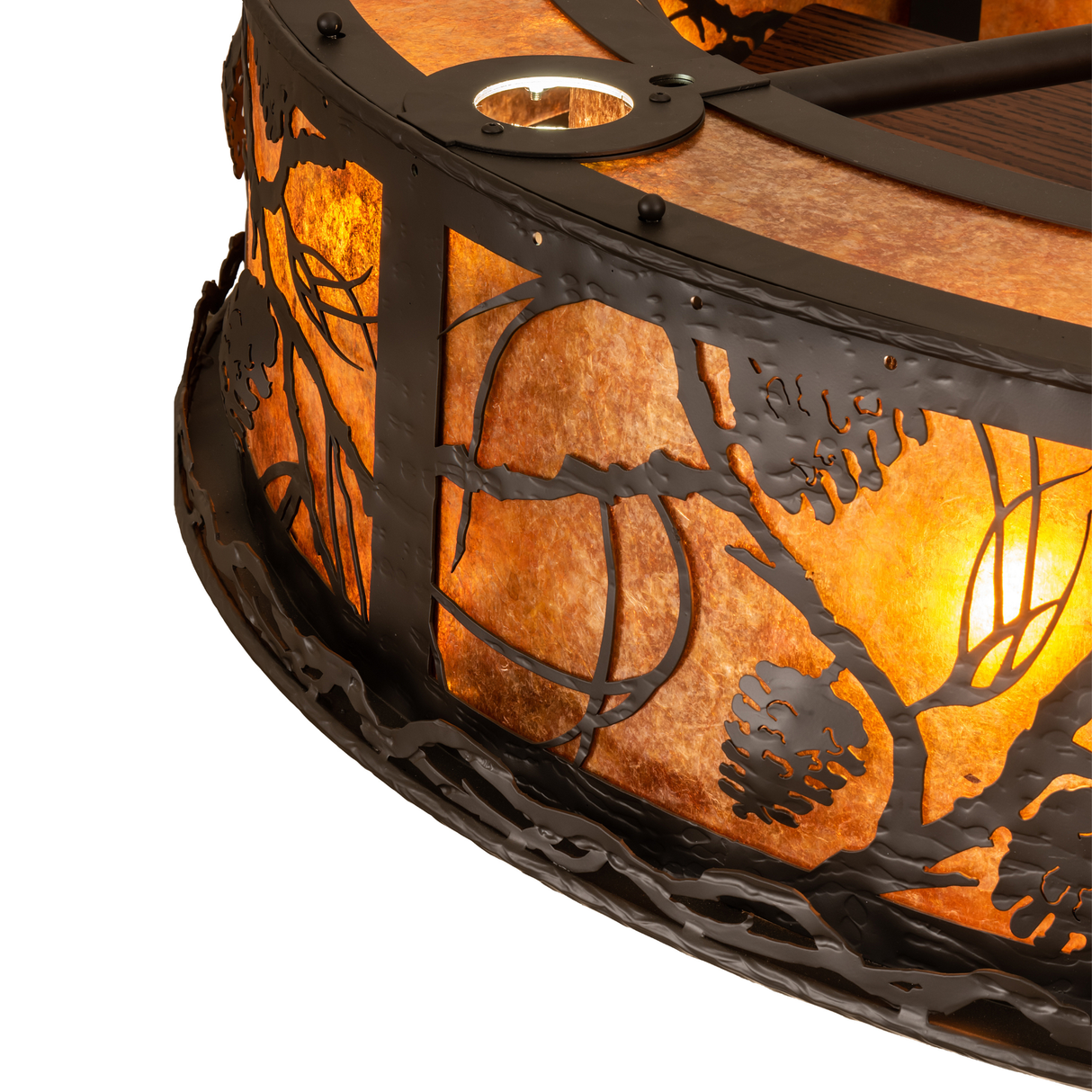 Corner detail of Whispering Pines Chandel-Air with layered pinecone pattern.