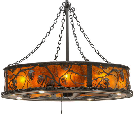 Front lit view with glowing amber mica panels and pine branch cutouts.