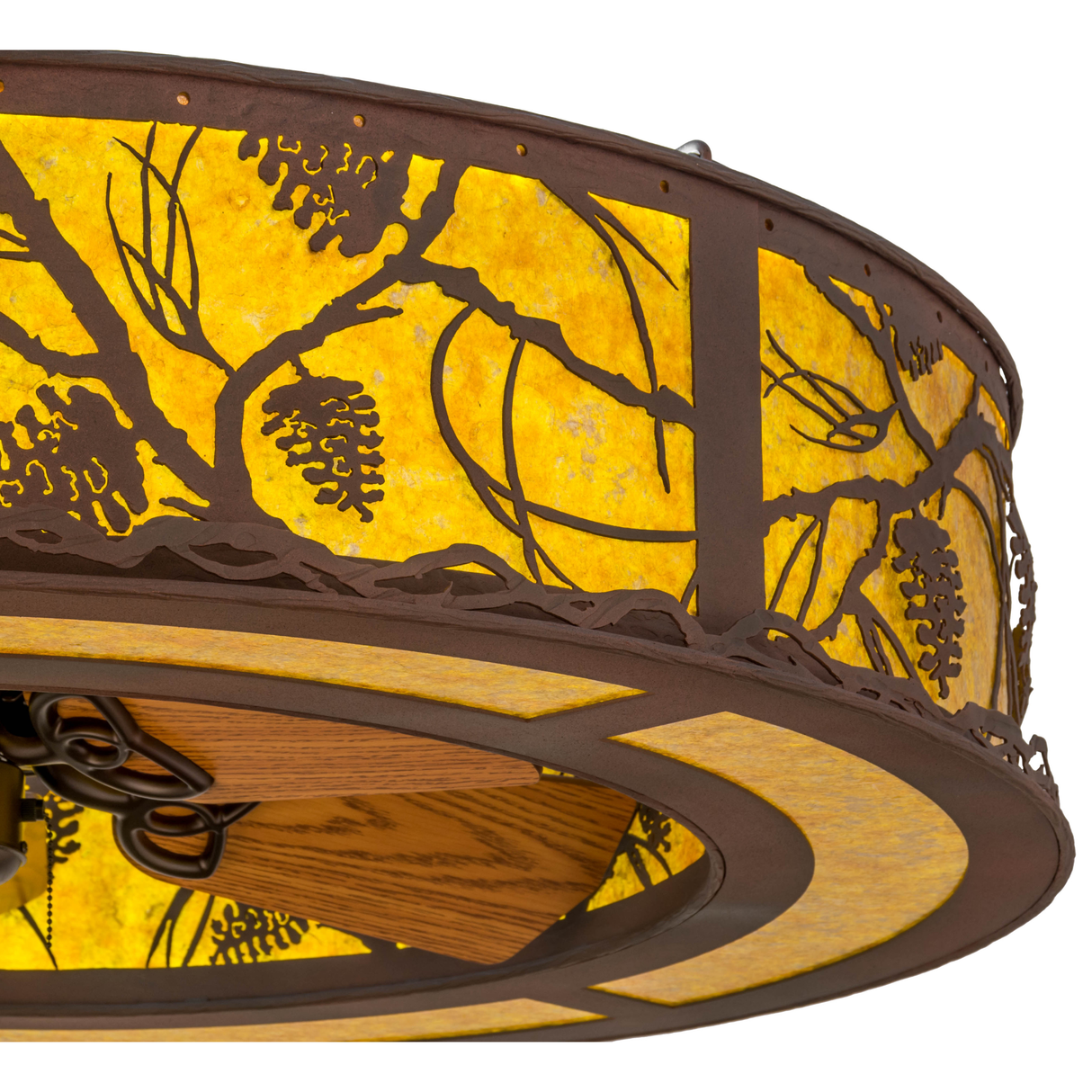 Closeup of detailed pinecone and branch cutouts on amber mica.