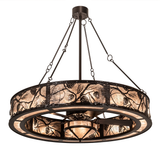 Front angle lit view of Whispering Pines Chandel-Air with pinecone motifs.