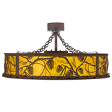 Front view showing glowing amber diffuser and pine branch pattern.