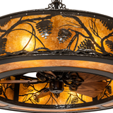 Close-up of fan beneath softly glowing mica and metalwork.