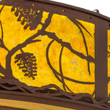 Shade detail showing textured pine branch and cone design.