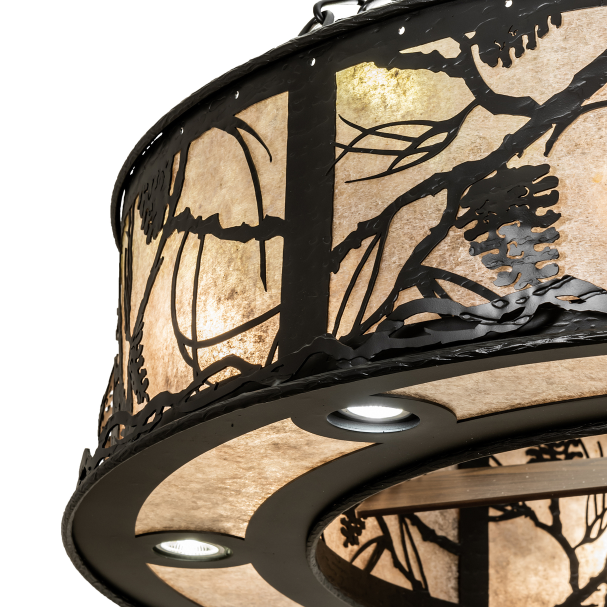 Close-up of handcrafted pine branch and cone pattern on mica panel.