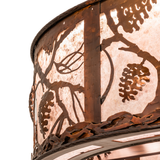 Close-up of pinecone and branch metalwork on Whispering Pines Chandel-Air.