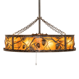 Side angle lit view showcasing handcrafted pinecone silhouettes and glowing amber panels.