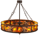 Top angle lit view showing glowing amber mica panels and pinecone pattern.