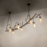 Winter Solstice oblong chandelier shown in ambient setting with warm illuminated mica shades.