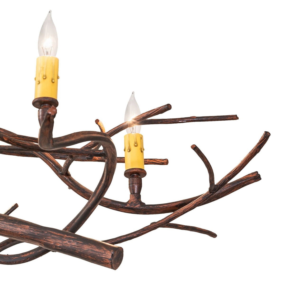 Close-up of ivory faux candlelight mounted on rustic metal branches.