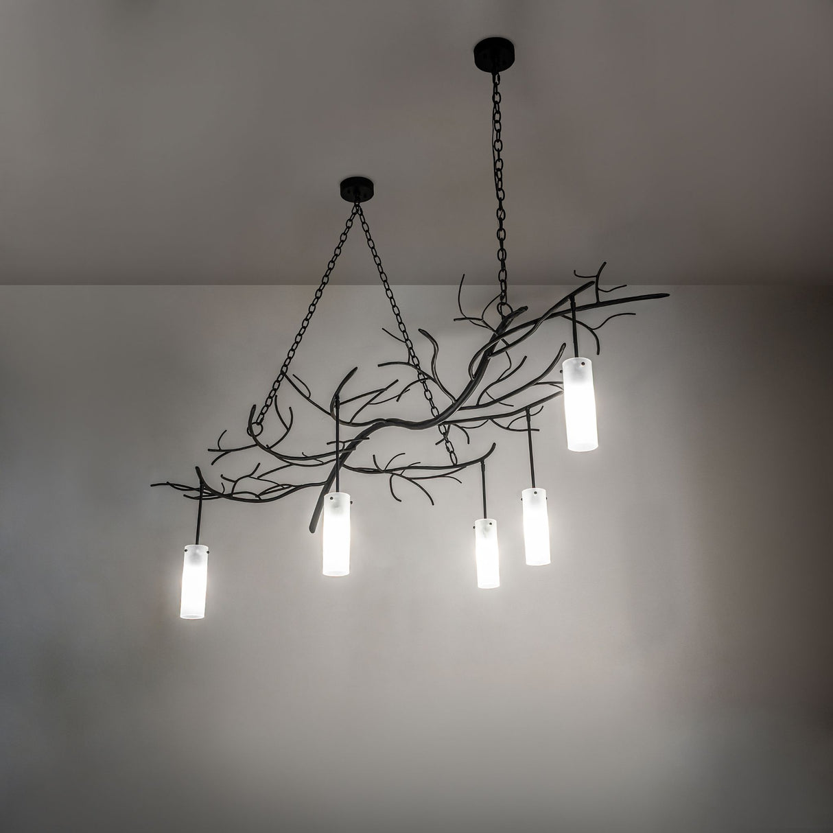 Ambient room view of the Winter Solstice chandelier softly lighting the space.