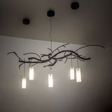 Ambient view showing softly illuminated frosted glass cylinder shades.