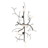 Bottom view showing downward-facing glass cylinders and organic metal branch arrangement.