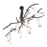 Angled view of the chandelier showcasing branch-style arms and suspended glass shades.