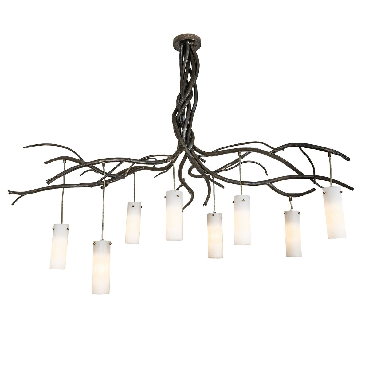Lit view of the chandelier showing warm light from eight cylindrical glass shades.