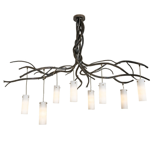 Lit view of the chandelier showing warm light from eight cylindrical glass shades.