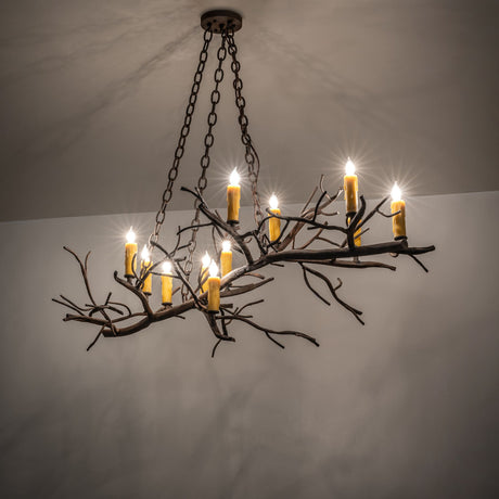 Winter Solstice oblong chandelier glowing in a dark ambient room.