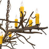 Close-up branch view highlighting organic twig textures and candle details.
