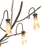 Close-up of silver mica shade mounted on sculpted branch-style metal arm.