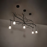 Ambient lighting over interior space highlighting organic branch-inspired metal design.