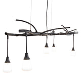 Angle view of chandelier with glass shades suspended from sculptural branch-style frame.